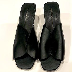 Intentionally Blank Jones. Black leather slip on sandals.